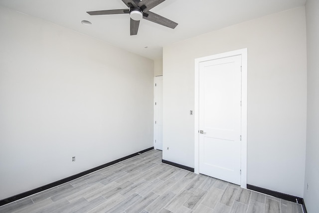209 Silverleaf Rd, Sweeny, TX 77480 - unfurnished bedroom featuring light wood-style flooring, baseboards, and ceiling fan