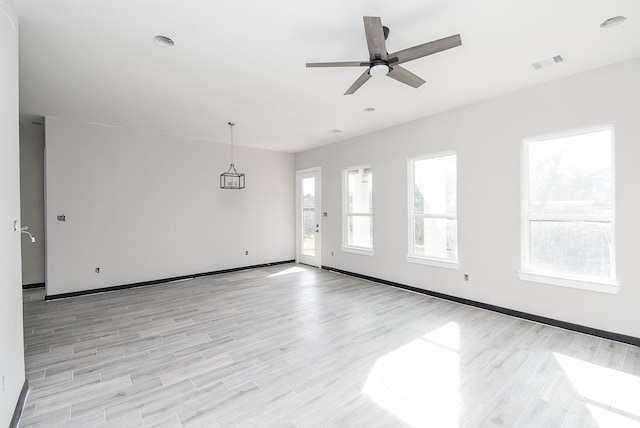 spare room featuring light hardwood / wood-style floors and ceiling fan