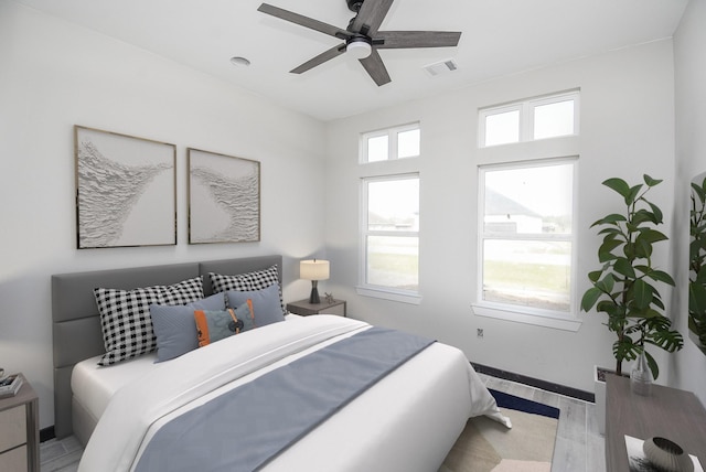 bedroom featuring light wood-type flooring and ceiling fan