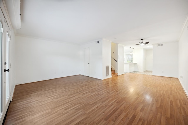 unfurnished living room featuring light hardwood / wood-style floors, plenty of natural light, ceiling fan, and crown molding