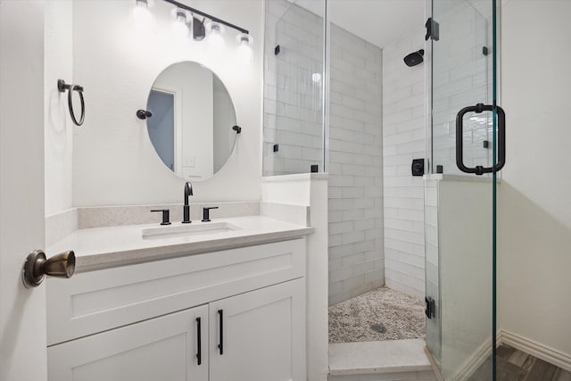 bathroom with vanity and walk in shower