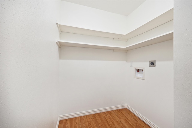 laundry area featuring hookup for a washing machine, hardwood / wood-style floors, and hookup for an electric dryer