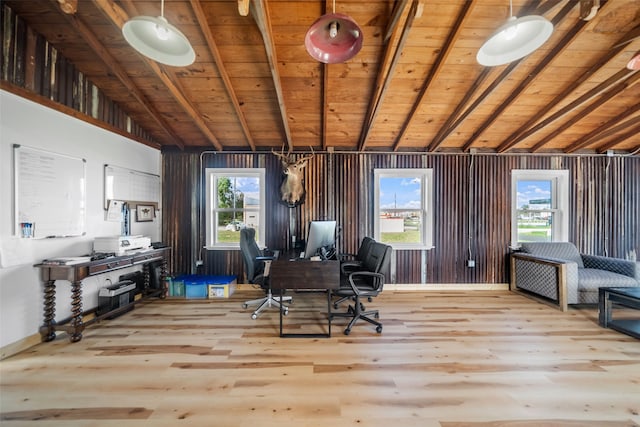 office area featuring vaulted ceiling with beams, light wood-type flooring, and a wealth of natural light