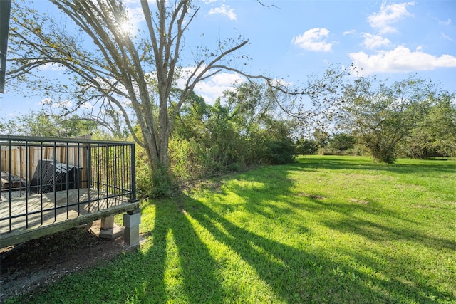 view of yard with a wooden deck