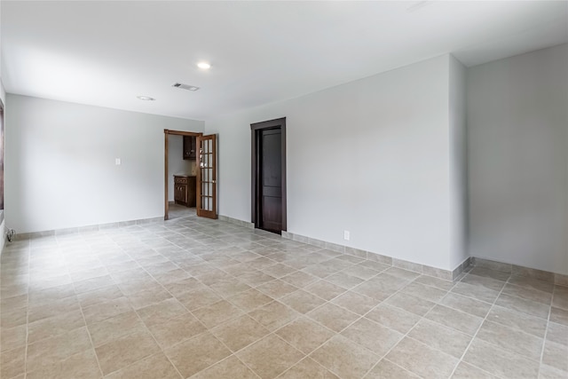 view of tiled spare room