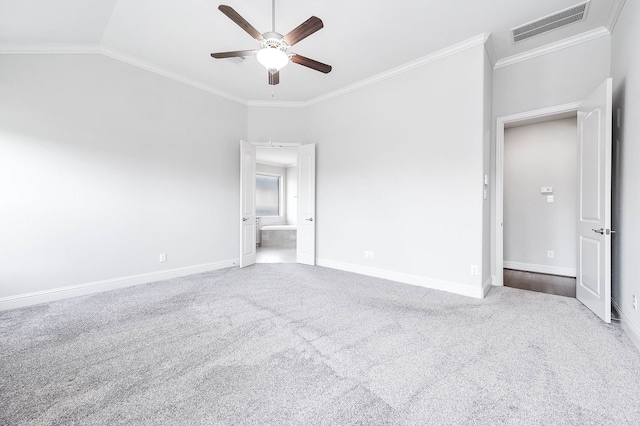 unfurnished bedroom featuring ceiling fan, lofted ceiling, crown molding, and carpet floors