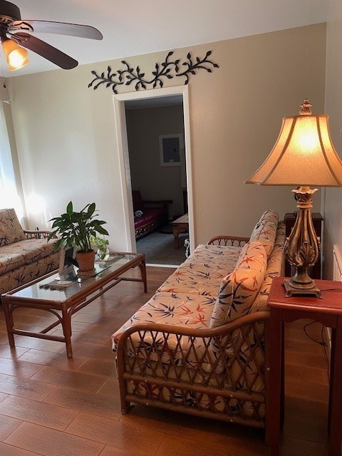 bedroom with ceiling fan and hardwood / wood-style floors