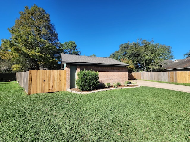 view of side of property with a lawn