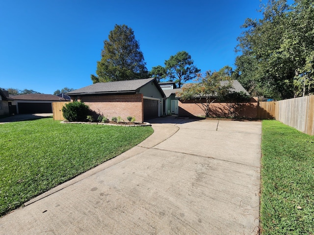 view of property exterior with a garage and a lawn