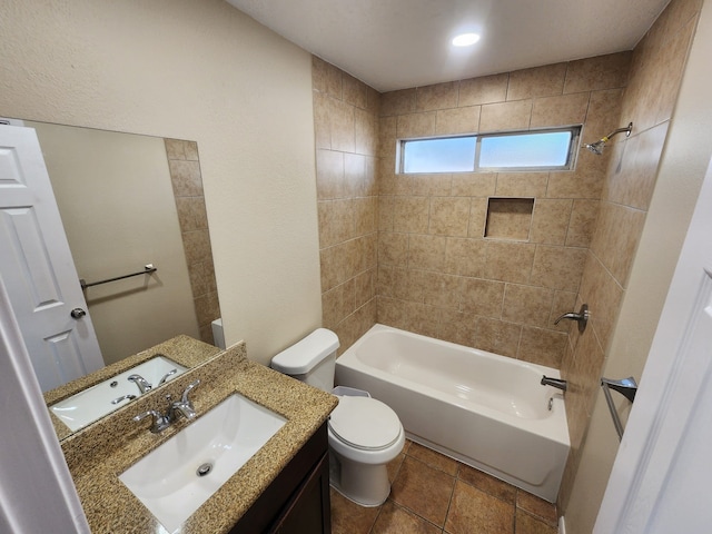 full bathroom with vanity, toilet, and tiled shower / bath