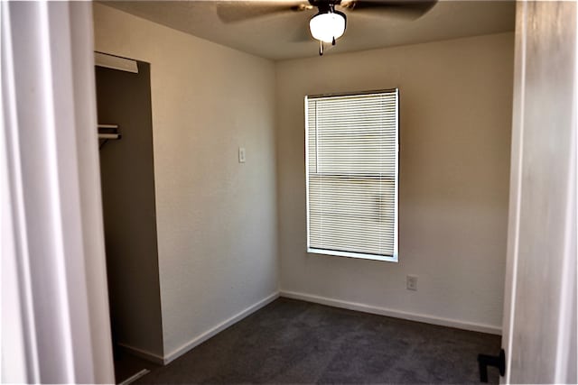 carpeted empty room featuring ceiling fan