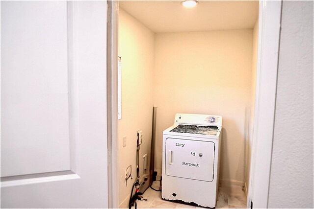 washroom with washer / clothes dryer