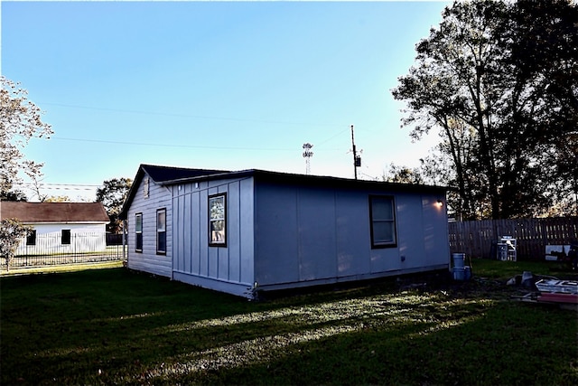 view of property exterior with a yard