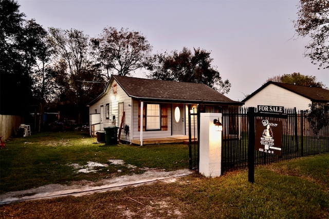 bungalow-style house featuring a yard