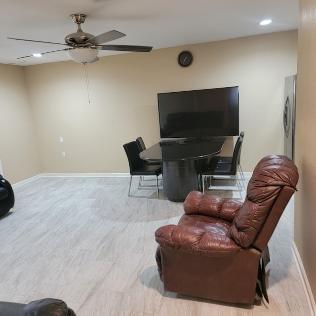 sitting room with recessed lighting, a ceiling fan, and baseboards