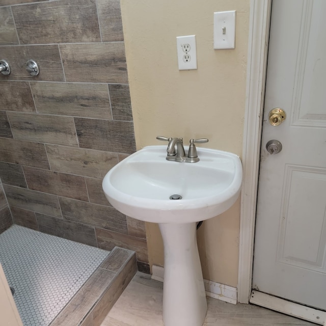 full bathroom featuring a stall shower