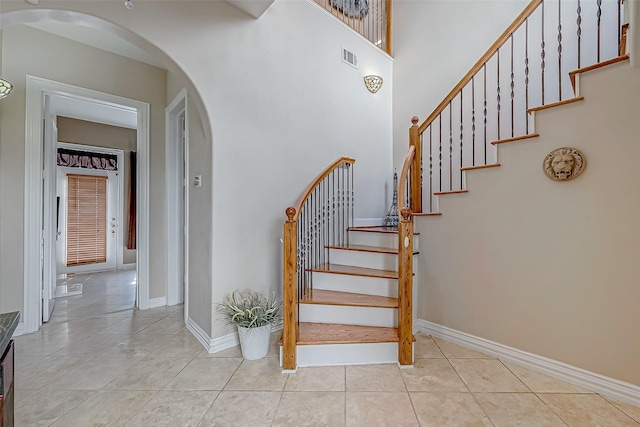 stairs with tile patterned flooring