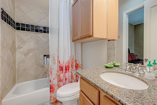 full bathroom with shower / bathtub combination with curtain, vanity, and toilet