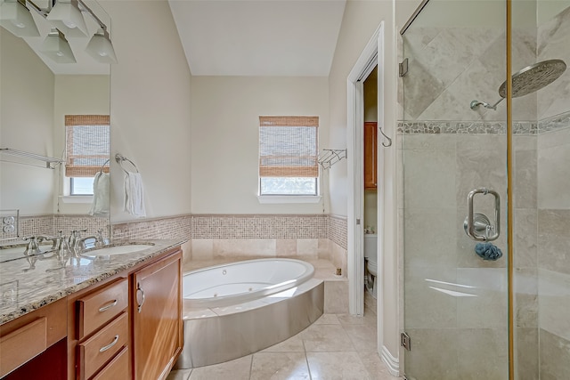 full bathroom with separate shower and tub, tile patterned flooring, vanity, and toilet