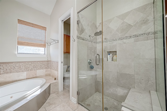 bathroom featuring tile patterned floors, toilet, independent shower and bath, and vaulted ceiling