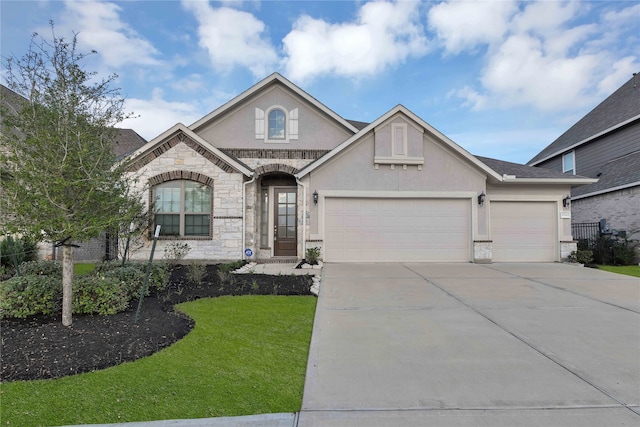 view of front facade with a front yard and a garage