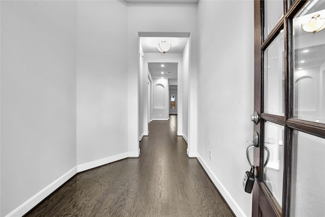 hallway featuring dark hardwood / wood-style floors