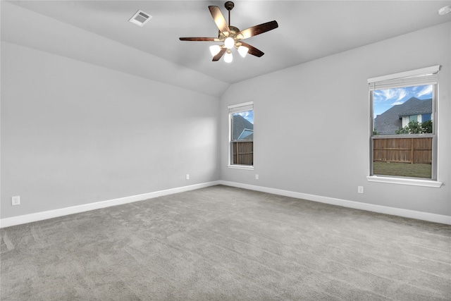 spare room featuring carpet floors, ceiling fan, and lofted ceiling