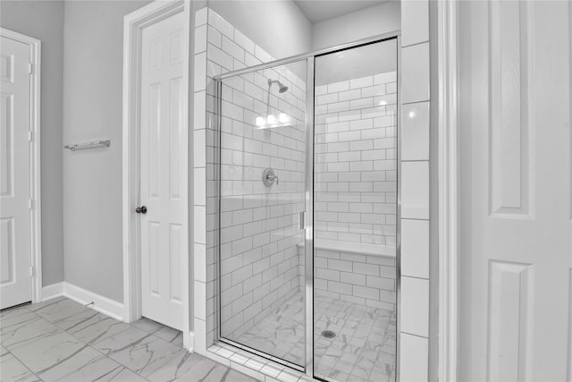 bathroom with a shower with shower door