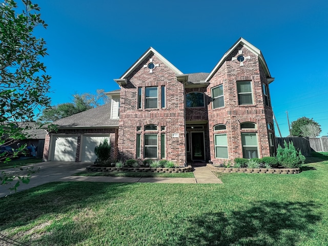 view of front of home featuring a garage and a front lawn