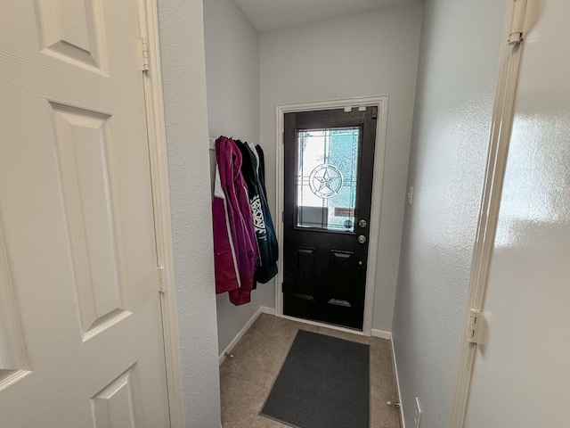 entryway featuring light tile patterned floors