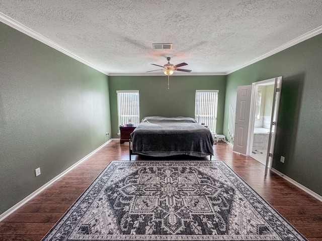 bedroom with connected bathroom, hardwood / wood-style flooring, ceiling fan, and ornamental molding