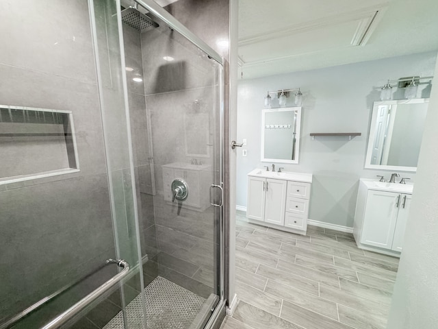 bathroom featuring vanity and an enclosed shower