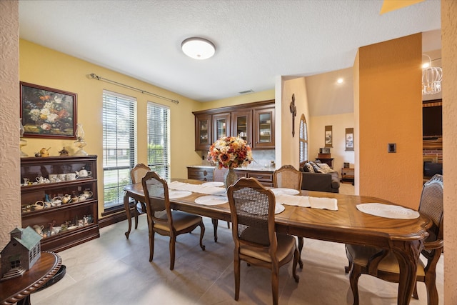 dining room with a textured ceiling