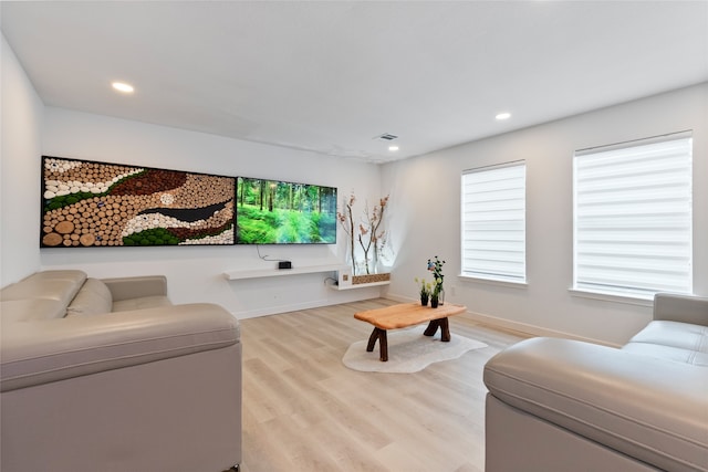 living room with light hardwood / wood-style flooring