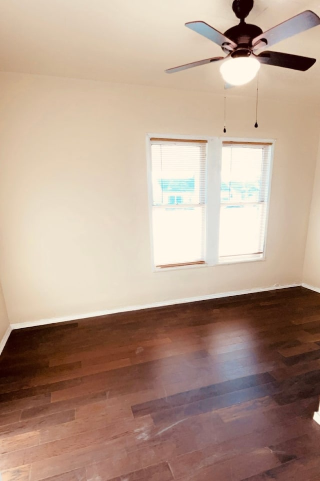 empty room with wood-type flooring and ceiling fan