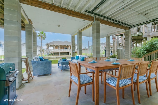 view of patio with an outdoor hangout area and grilling area