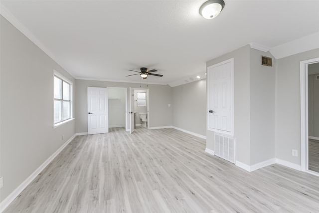 unfurnished living room featuring ceiling fan, ornamental molding, and light wood-type flooring