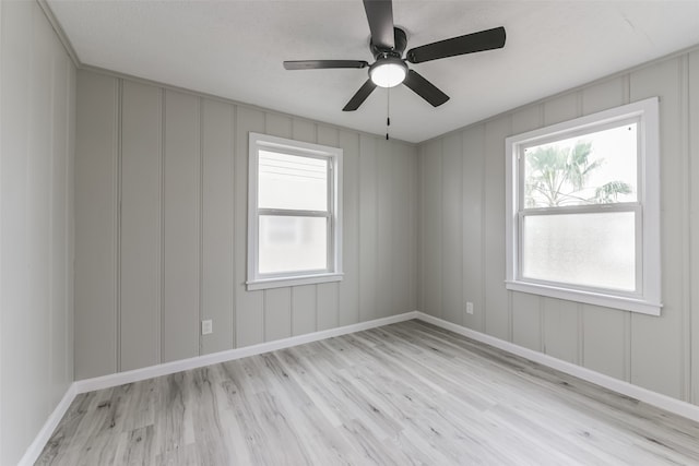 unfurnished room featuring ceiling fan and light wood-type flooring