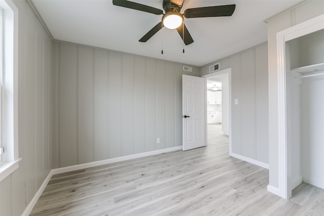 unfurnished bedroom with ceiling fan, light hardwood / wood-style floors, and a closet