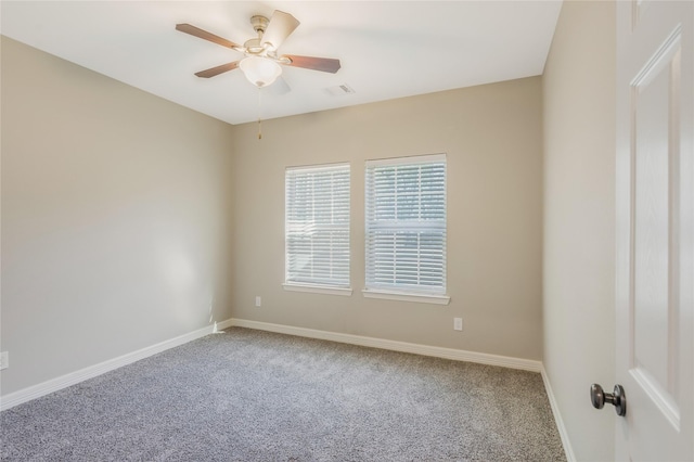 16979 Concord Dr, Conroe, TX 77385 - empty room featuring carpet floors, a ceiling fan, and baseboards