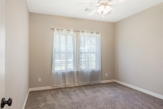 empty room featuring carpet flooring and ceiling fan