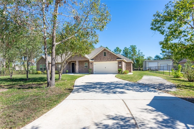 view of front of house with a front lawn and a garage