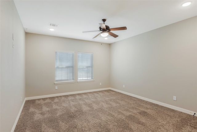 empty room with light carpet and ceiling fan