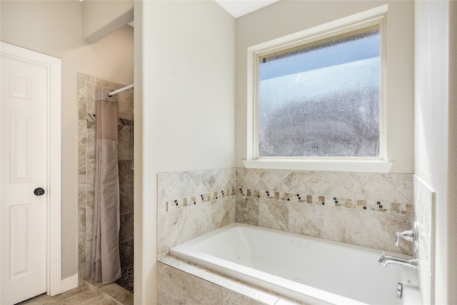 bathroom with separate shower and tub