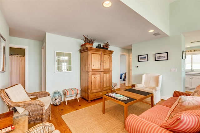 living room with light hardwood / wood-style floors