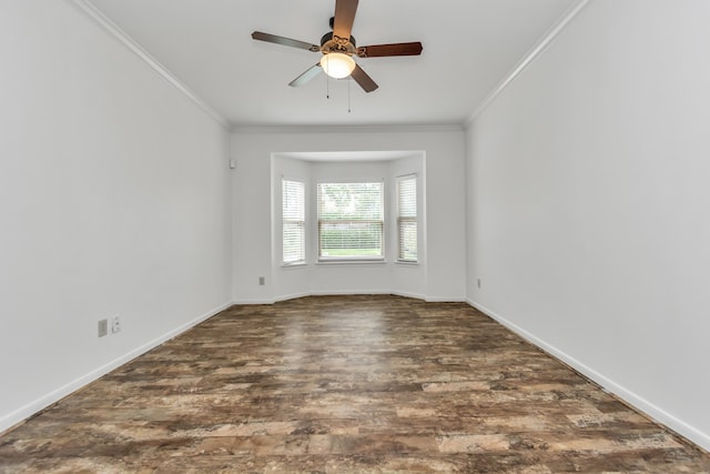 spare room with dark hardwood / wood-style floors, ceiling fan, and crown molding