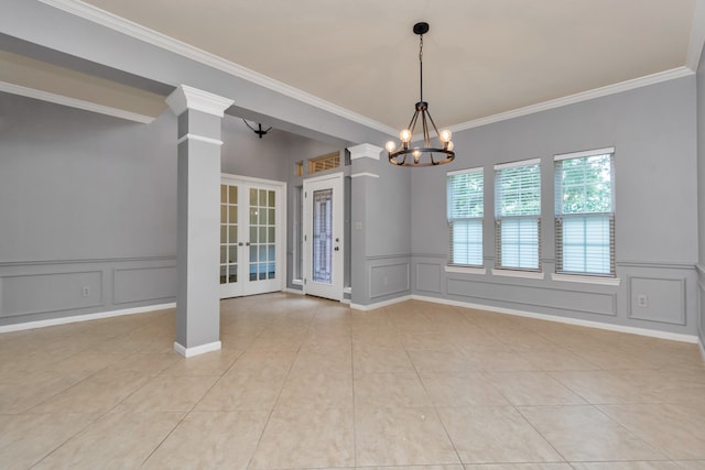 tiled empty room with french doors, ornamental molding, and a notable chandelier