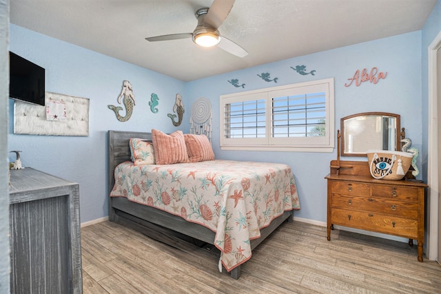 bedroom featuring ceiling fan and light wood-type flooring