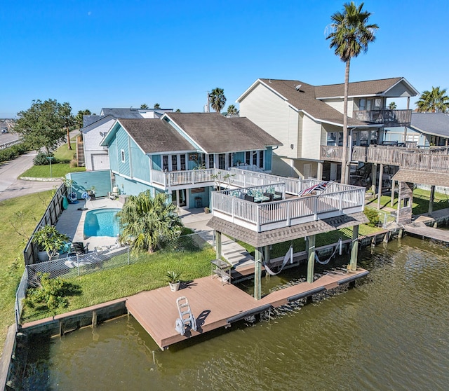 dock area with a pool side deck with water view