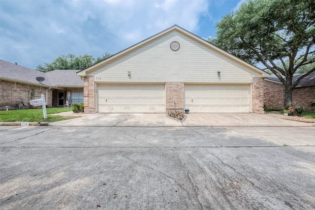 ranch-style home featuring a garage